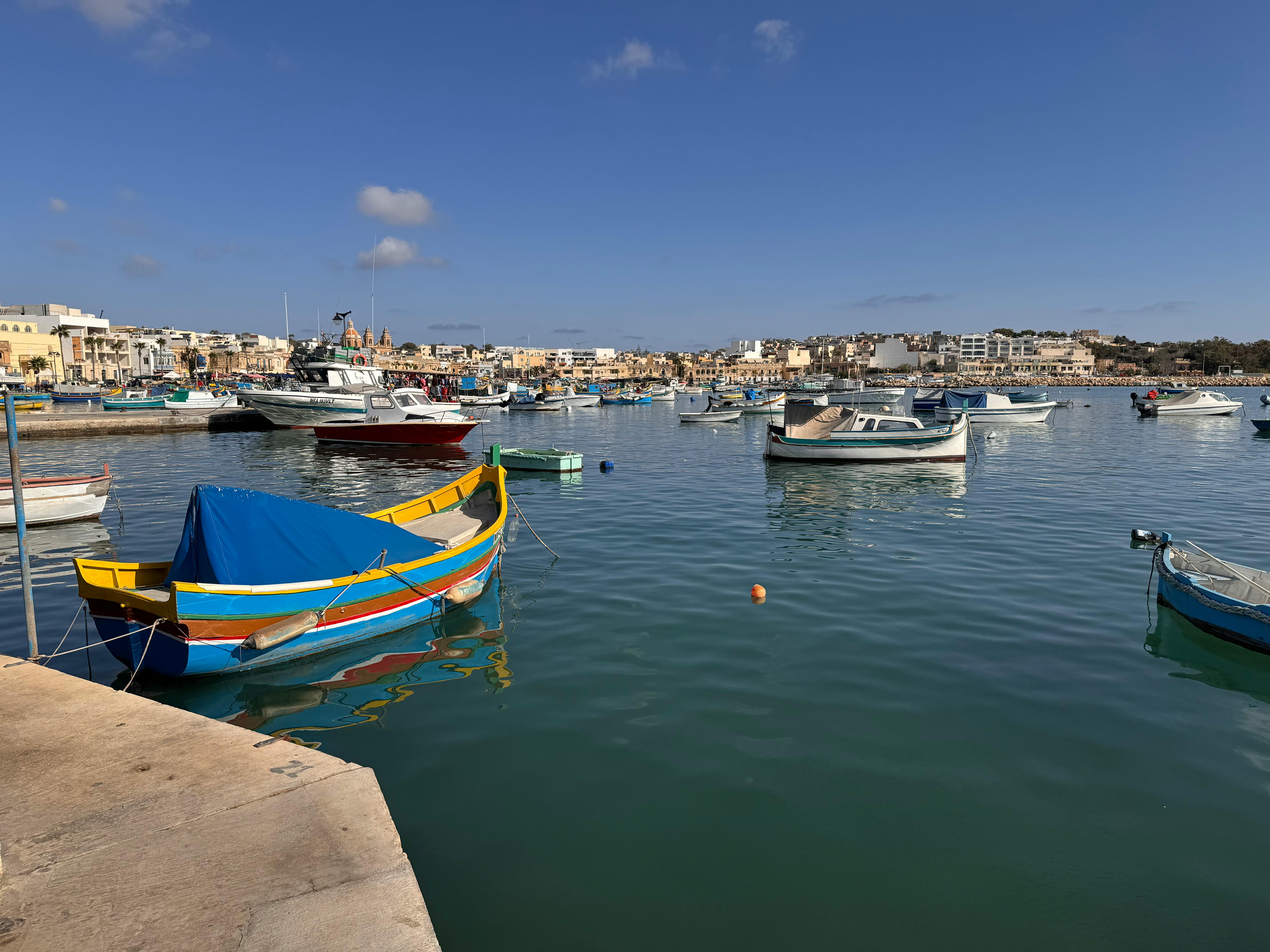 Colourful luzzu boats in Marsaxlokk harbour