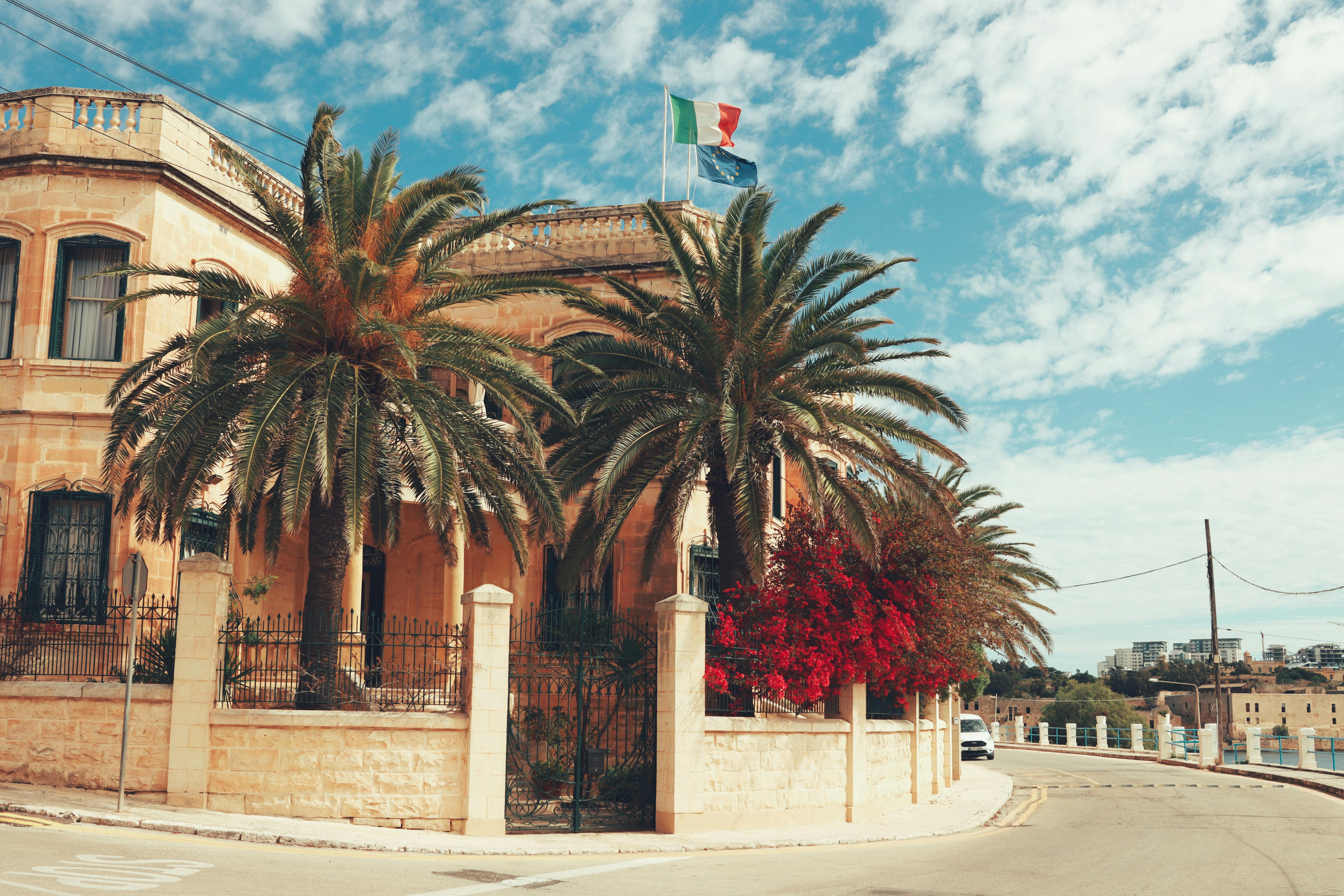 Historic palazzo language school with palm trees